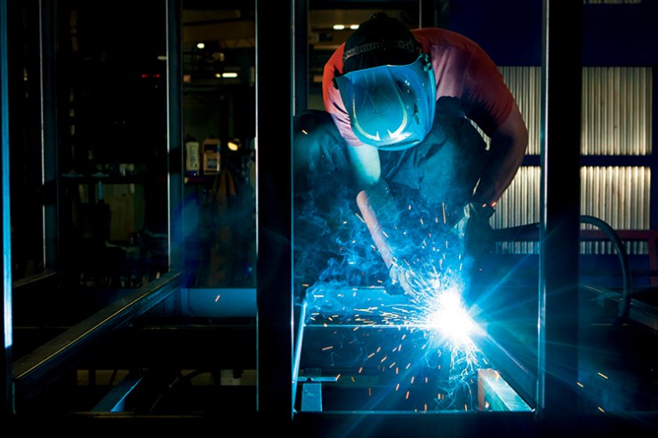 Foundations for Growth- man welding steel