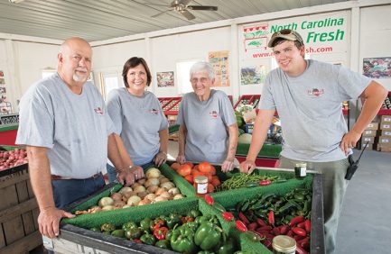 Curtis Smith and his family grow produce for the commissary at Camp Lejune, where it is purchased by military personnel and their families. He and his mother, Nell Smith, wife Kim and stepson David Ball also operate a produce market from their farm.