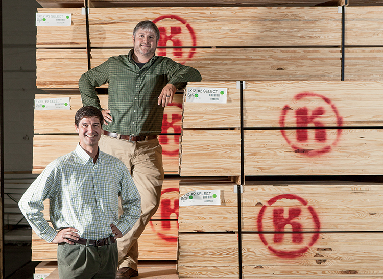Stewart O’Neill and Chad Hammonds of Klumb Lumber Company store their lumber prior to export at Merchants Transfer & Warehouse in Mobile.