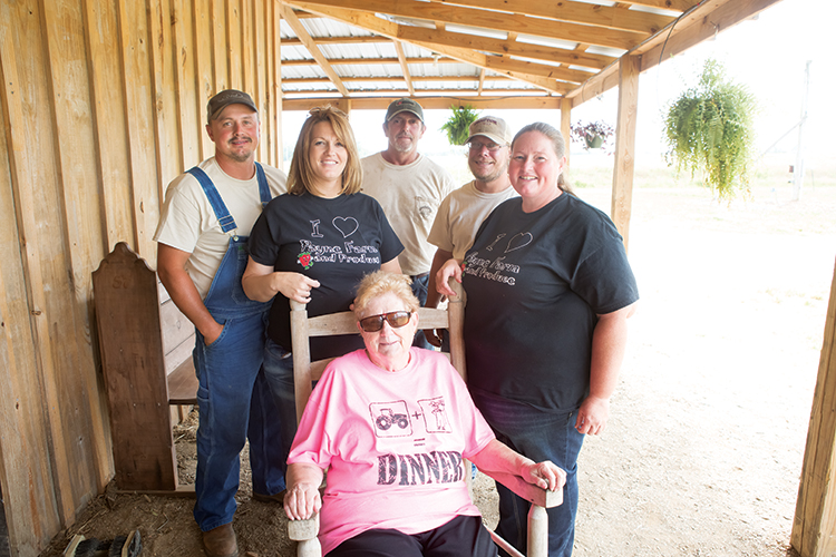 Ann Payne, middle, is surrounded by farm manager Sonny Fox, his wife and store employee, Amy Fox, farmhands Drew Herring and Brandon Gravitt, and Carla Payne on the back porch of the farm market.