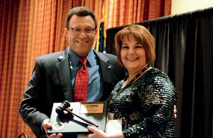 Keith Reiner presents an award on behalf of the Oklahoma Pork Council.