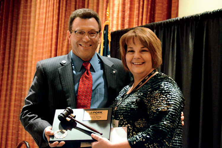 Keith Reiner presents an award on behalf of the Oklahoma Pork Council.