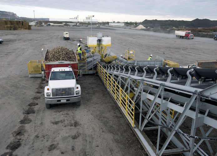 Truck loads of sugar beets arrive at the Western Sugar Cooperative facility in Scottsbluff, Nebraska 