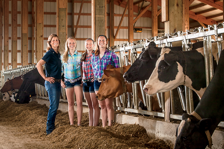 Stacy Eberle and her daughters, Josie, Carli and Maria all work on the family dairy farm.