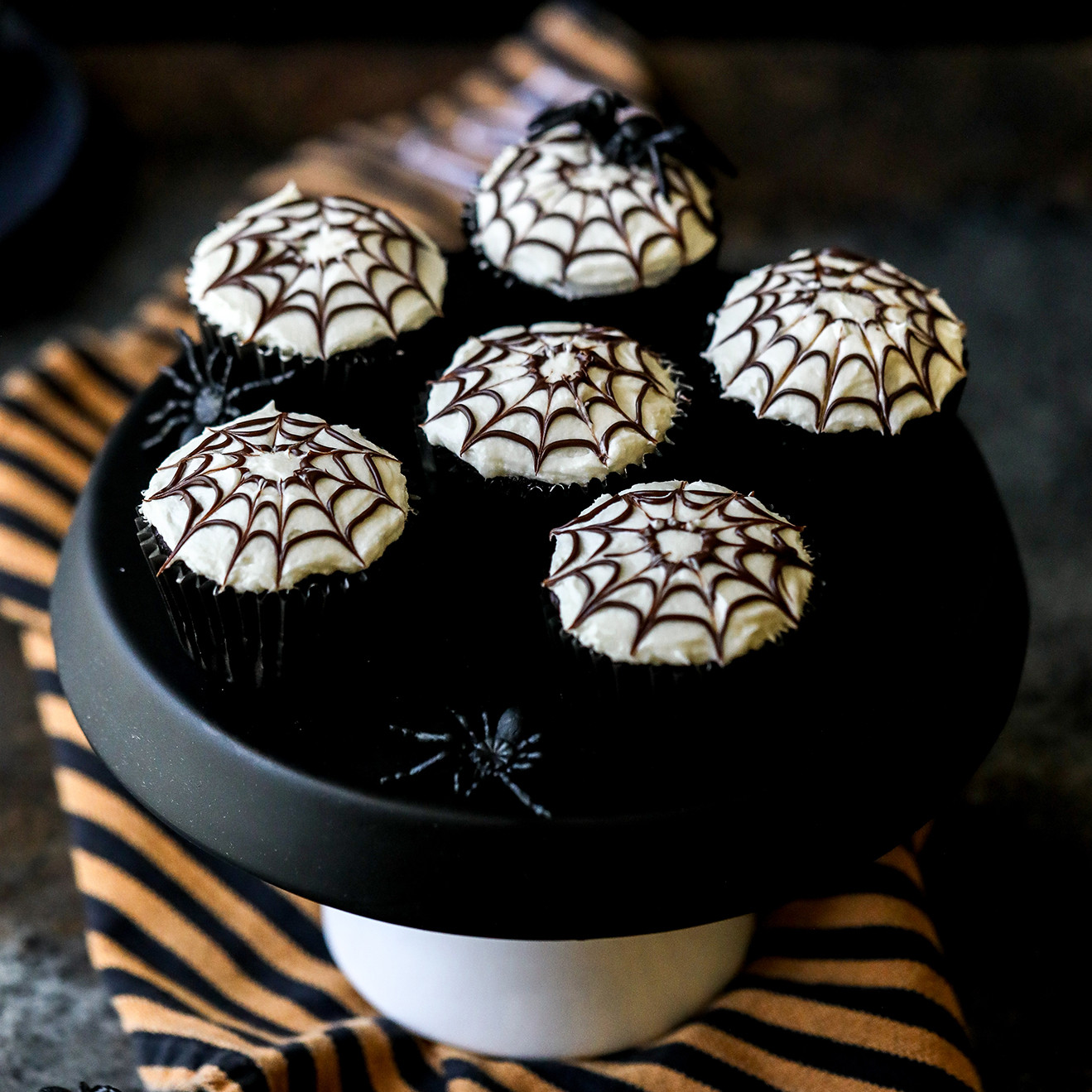 Hosting a Halloween party soon? Chocolate Spider Web Cupcakes make a scary-good dessert.⁠
⁠
Find the recipe at the link in our bio!⁠
⁠
📸: @jessiskitchen