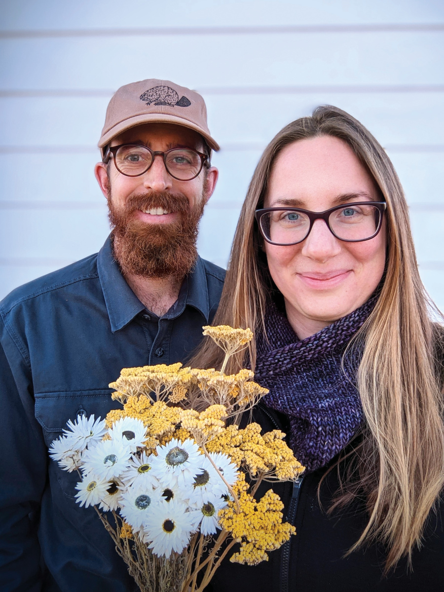 Aaron and Justine with a bouquet of cut flowers from Tupelo Farm & Garden
