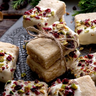White Chocolate-Dipped Shortbread Bars with Cranberries and Pistachios