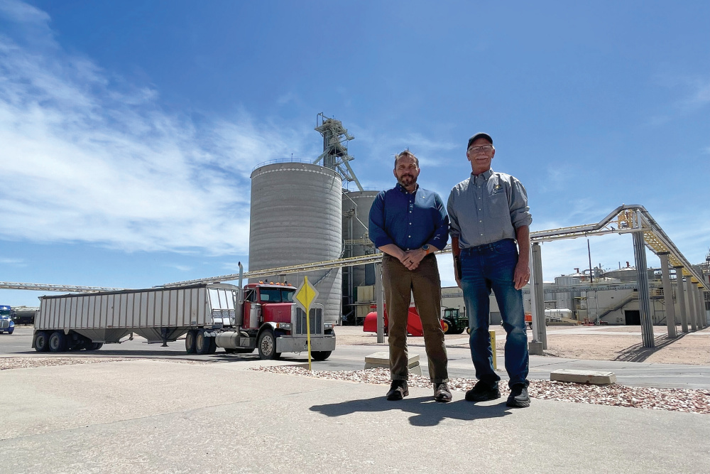 Carbon America CEO Brent Lewis, left, and Yuma Ethanol General Manager Dave Kramer, stand in front of the ethanol plant’s corn silos.